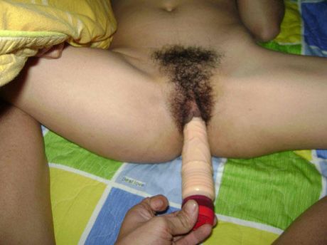 Asian girl with glasses and pigtails toying her hairy pussy in a solo