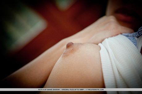 Amazing Asian teen Ruth A. strips and rubs wet pussy in a solo show