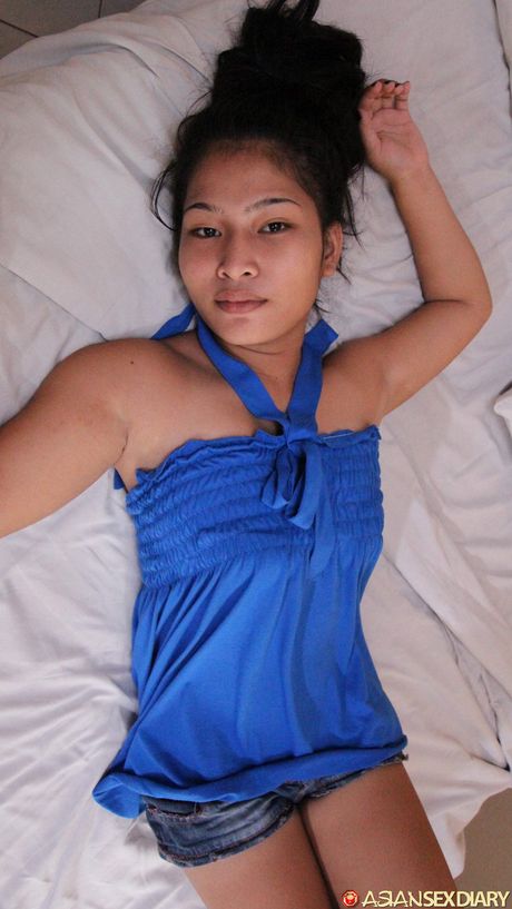 The Asian teen Michelle is a horny little thing who loves to get naked