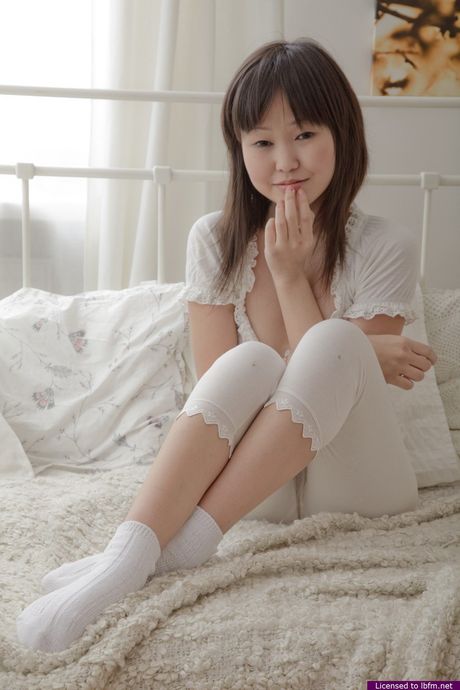 Asian teen amateur strips and reveals her tiny tits and pink pussy