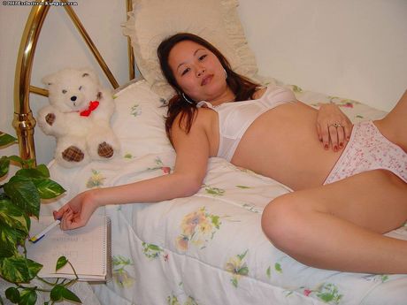 Luscious asian teen China in tight jeans uncovers small tits and puts a toy in her cunt